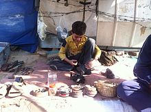 Pathan_cobbler_in_his_workspace